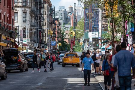 New York, USA - June 6, 2019:  Street with traffic and people around in Manhattan in New York City,...