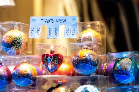 Christmas shop window with paper with the phrase: Take New and with a 2020 sign ready to be tore off - imageの写真素材