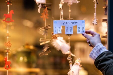 Human hand keeps for paper ad with the phrase: Take New and with a 2020 sign ready to be tore off - imageの写真素材