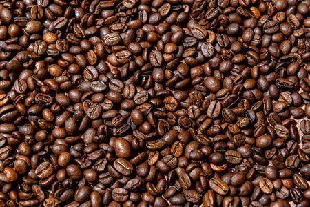 Close-up of brown, roasted coffee beans  background - image