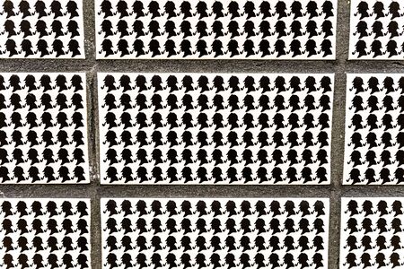 London, England, UK - January 2, 2020: Black and white wall tiles with Sherlock Holmes silhouette at Baker street underground station - imageのeditorial素材