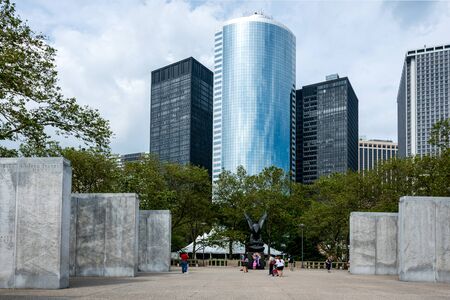 New York, USA - June 7, 2019: The East Coast Memorial in Battery park with people walking around