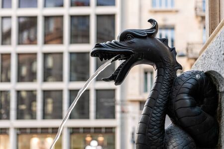The fountain called Escalade, water spouts in the fountain through bronze dragon, close-up, Geneva, Switzerland - imageの写真素材