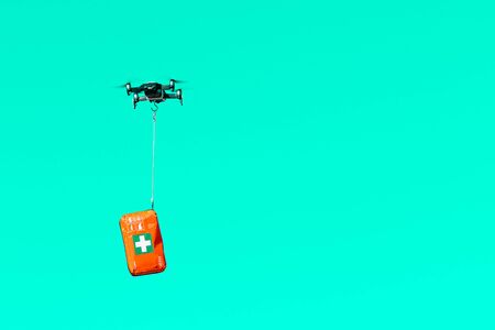 drone delivers a first aid kit with coronavirus medication, concept for delivery of COVID-19 virus medication using modern technologyの写真素材