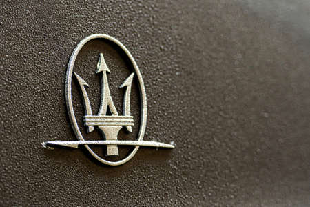 London, England, UK - December 31, 2019: the trident logo of the Maserati car company on a shiny car...
