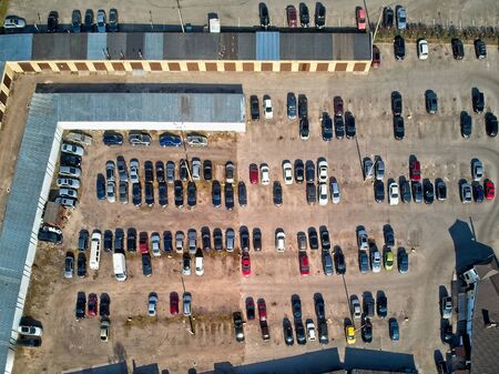 aerial top view of garages and car parking lot in sleeping district of the cityの写真素材