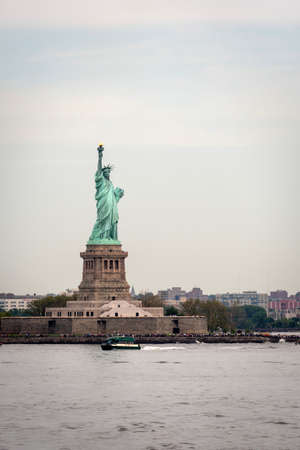 New York, USA - June 7, 2019: Ferry Boat approaching the Statue of Liberty, Liberty Island - Imageのeditorial素材