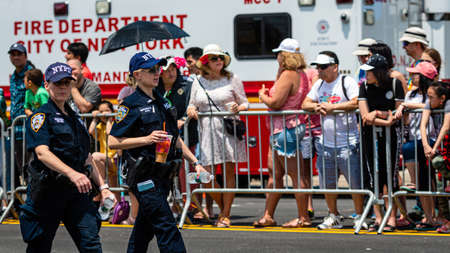 Brooklyn, New York City, USA - June 22, 2019: Coney Islands annual mermaid parade, NYPD officer...