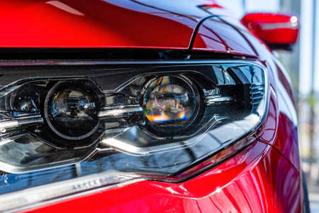 Close-up of the front light of a modern car. Exterior details - imageの写真素材
