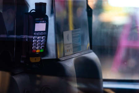 London, England, UK - December 31, 2019: An abstract view through a taxi window to a bank terminal for payment for a London taxi rid - imageのeditorial素材