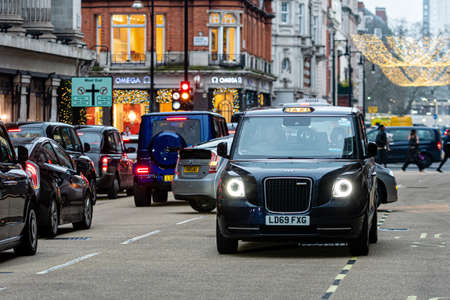 London, England, UK - December 31, 2019: Traffic jam in London center with Taxi cars in the evening hours - imageのeditorial素材