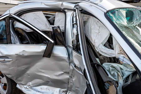 damaged vehicle closeup after a heavy crash, car accident, insurance concept