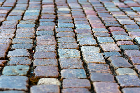 stone pavement texture, granite cobblestoned pavement background, abstract background of old cobblestone pavement close-upの写真素材