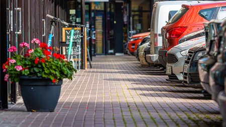 Riga, Latvia - September 30, 2020: a row of cars in the parking lot outside the office building, close-upのeditorial素材