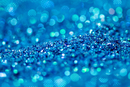 abstract of bright and sparkling bokeh background, blue and silver bokeh, blurred lighting from glitter texture, soft focusの写真素材
