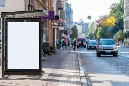vertical blank white billboard at bus stop on city street, mock-upの写真素材