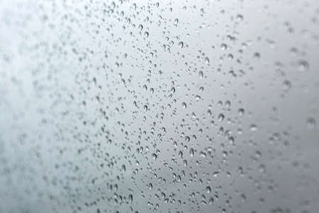 Drops of rain on glass , selective focus, rain drops on clear window
