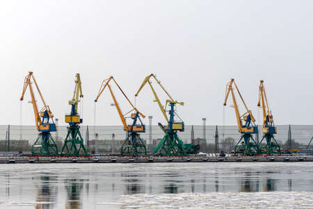 portal cranes on the berth for bulk cargo of the commercial port of Rigaの写真素材