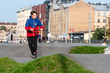 Riga, Latvia - September 30, 2020: the teenage in the skatepark carries out various tricks with bicyclesのeditorial素材