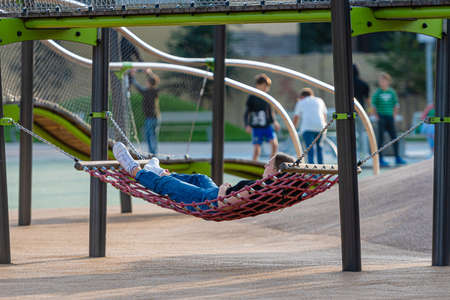 Riga, Latvia - September 30, 2020: teenagers spend their free time in public outdoor sports and recreation centerのeditorial素材
