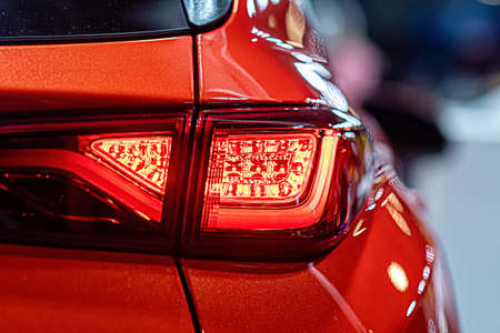 close-up of a red taillight on a modern car, detail on the rear light of a carの写真素材