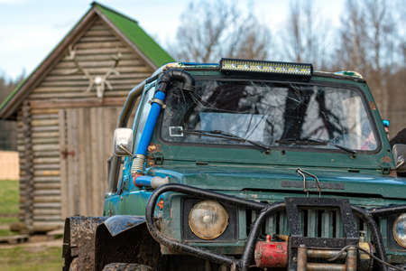 Gulbene, Latvia - May 02, 2021: Compact Japanese SUV Suzuki with off-road tuning in a farmyard, , close-up detailsのeditorial素材