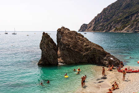 Monterosso, Italy - August 10, 2021: A Rock on Fegina Beach in Monterosso al Mare on a Summer Day