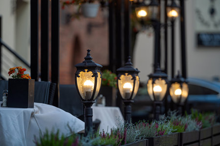 light lanterns along the street cafe, street evening lights, closeupの写真素材