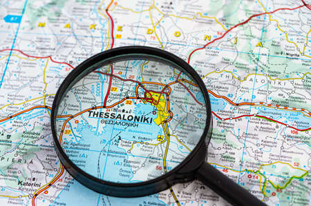 map of Thessaloniki in Greece through magnifying glass, concept of planning the travel itinerary