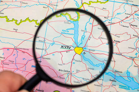 map of Kiev in Ukraine through magnifying glass, concept of planning the travel itinerary