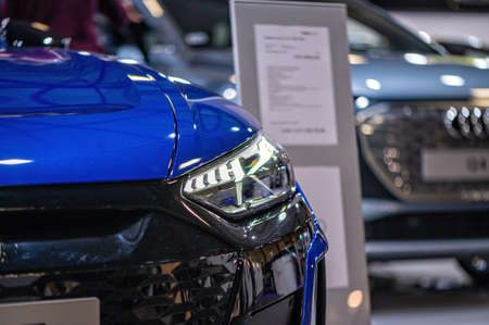 Riga, Latvia, Sep 24, 2021: Audi e-tron GT electric supercar premiere at a motor show, full LED headlights closeupのeditorial素材