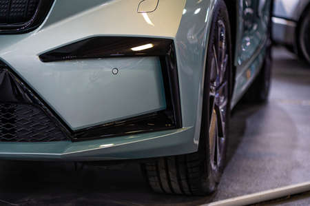 Riga, Latvia, Sep 24, 2021: Skoda Enyaq IV electric SUV premiere at a motor show, closeup of front...