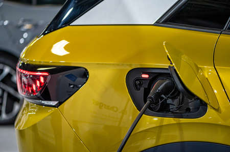 Riga, Latvia, Sep 24, 2021: vw id4 electric car connected to the charger, eco friendly technologyのeditorial素材