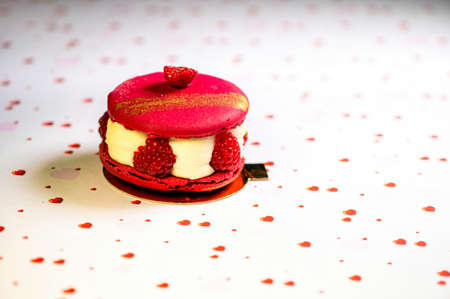 homemade cake with raspberries and sour cream on a white background with hearts, closeupの写真素材