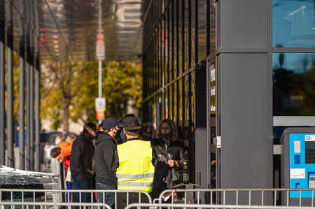 Riga, Latvia, October 9, 2021: queues of people at the entrance of LIDL supermarket in Riga on the...