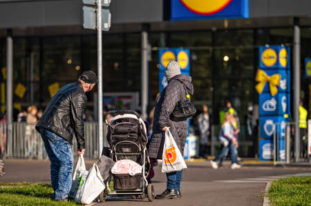 Riga, Latvia, October 9, 2021: queues of people at the entrance of LIDL supermarket in Riga on the...