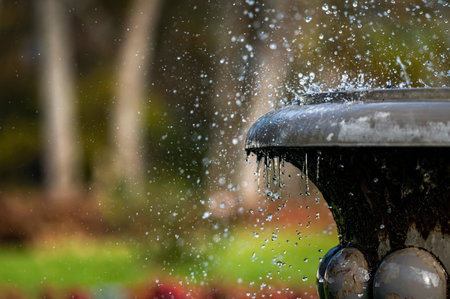 fountain splash closeup on the background of defocus manor park, selective focusの写真素材