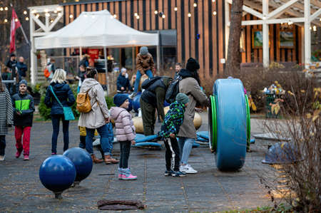 Riga, Latvia, October 30, 2021: children play on the playground on a sunny autumn afternoonのeditorial素材