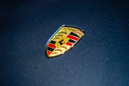 Riga, Latvia, Sep 24, 2021: view of Porsche company on the hood of the blue car, closeupのeditorial素材