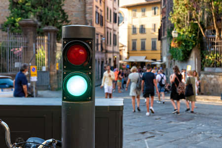 Florence, Italy - August 11, 2021: polar with red or green lights that control the flow of traffic in the historic center of Florenceのeditorial素材
