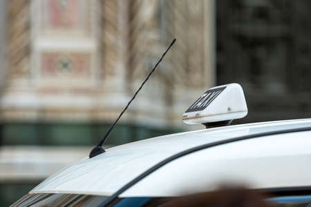 Taxi sign on a car roof, close-up, selective focus, defocused backgroundの写真素材