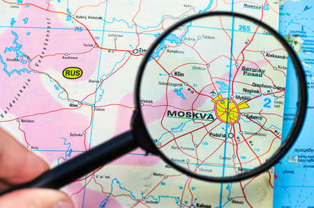 map of Moscow in Russia through magnifying glass, concept of planning the travel itinerary