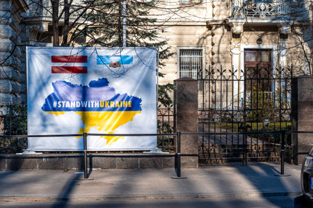 Riga, Latvia, March 18, 2022: poster #StandWithUkraine at the fence in front of the Ukrainian Embassy in Riga, Latviaのeditorial素材