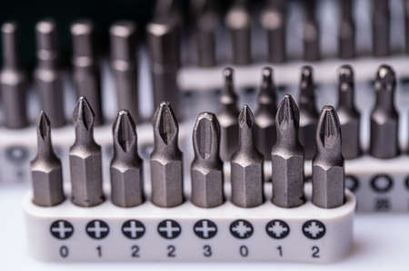 Interchangeable screwdriver bit set, isolated on white, selective focus,  dof, close-upの写真素材