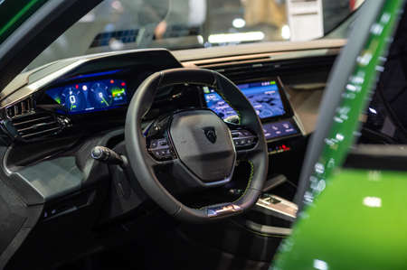 Riga, Latvia, April 29, 2022: Peugeot 308 interior, steering wheel, center console, cockpit,...
