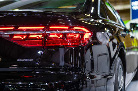 Riga, Latvia, April 29, 2022: LED rear lights and car design closeup of nev Audi A8 limousine, model...