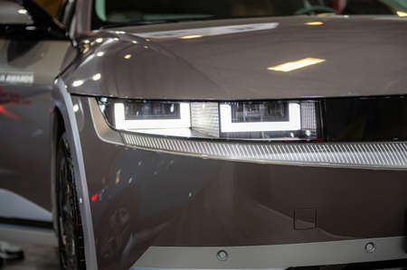 Riga, Latvia, April 29, 2022: LED headlights and car design closeup of nev Hyundai Ioniq 5 electric...