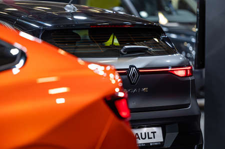 Riga, Latvia, April 29, 2022: LED rear lights and car design closeup of nev fully electric Renault Megane and Renault Arkanaのeditorial素材