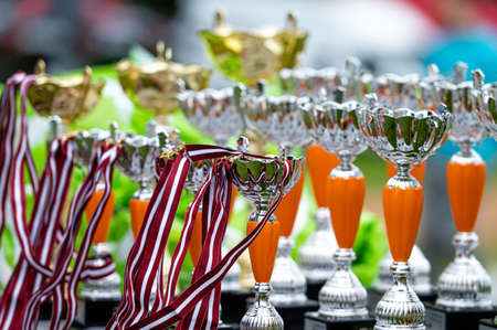 Dobele, Latvia, June 18, 2022: metal cups for awarding at motocross competitions, closeupのeditorial素材