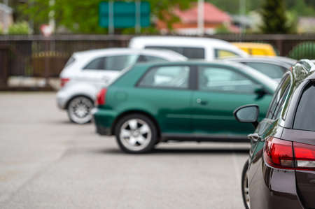 yard of a residential house with parked cars, the concept of neighborhood and populationの写真素材
